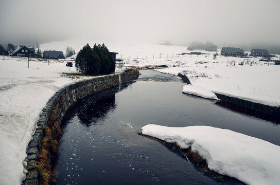 Jizerka village and river covered by snow in the winter
