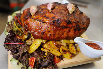 appetizing pork neck with potatoes and vegetables close-up