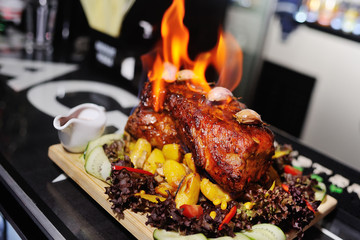 appetizing grilled meat on fire close-up. beautiful presentation of the dishes in the restaurant