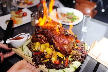 appetizing grilled meat on fire close-up. beautiful presentation of the dishes in the restaurant