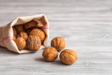 cosmetic and therapeutic walnut oil on wooden background