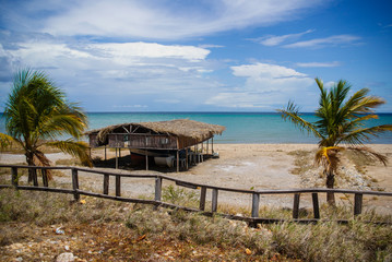 An old hut in the shores of a beach in a sunny day.