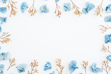 Naklejka na ściany i meble Frame made of dry flowers on white background. Hydrangea. Flat lay. Top view