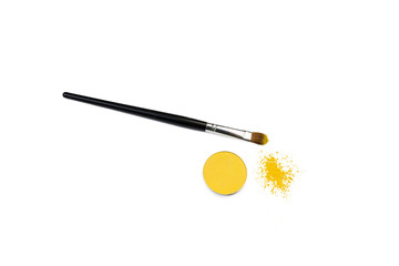 brush for correction of eyes in a yellow pigment.