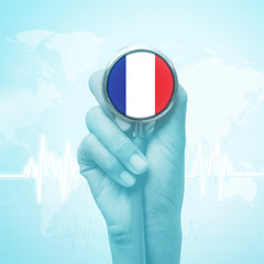 hand holding stethoscope with France flag.