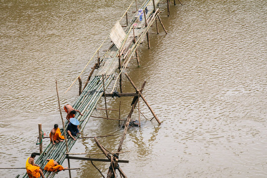 Construction workers working on footbridge over the Mekong River