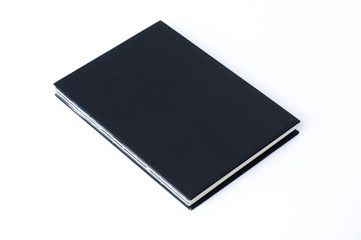 Black notebook on white background.