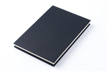Black notebook on white background.