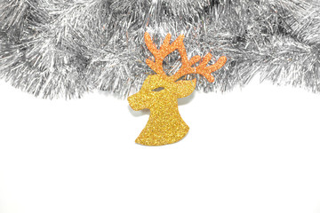 Image of handmade head reindeer hanging on rope over glitter gol © lessimol