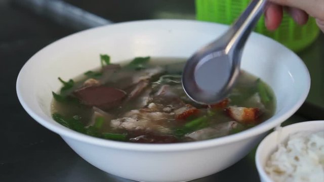 Jelly pork blood soup with organs and herb vegetable, Thai Chinese style breakfast