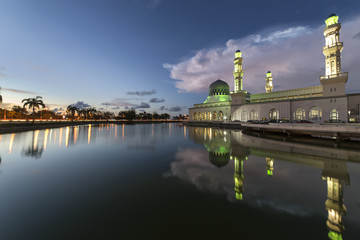 Beautiful twilight view City mosque in Kota Kinabalu, Sabah Borneo. Long exposure photograph with grain. Image contain certain grain or noise and soft focus.