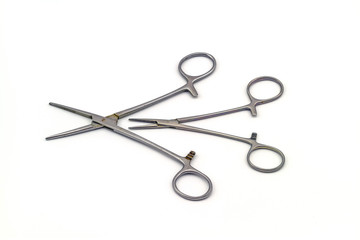Surgical instrument (hemostat or artery clamp ) on white background 