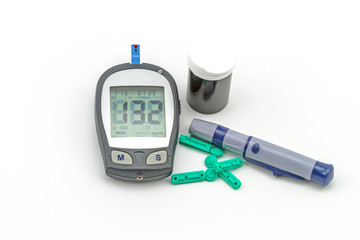 blood glucose meter test kit on white background