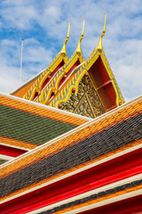 Fototapeta na wymiar Thai roof art architecture, Chedi made of chinese ceramic tiles in Wat Phra Chetupon Vimolmangklararm (Wat Pho) temple in Thailand