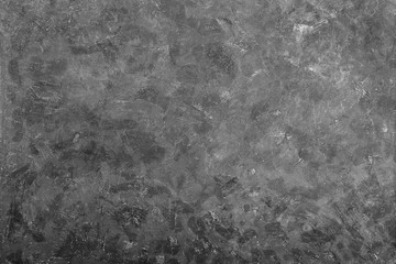 Fototapeta na wymiar Dark grunge textured cement wall closeup