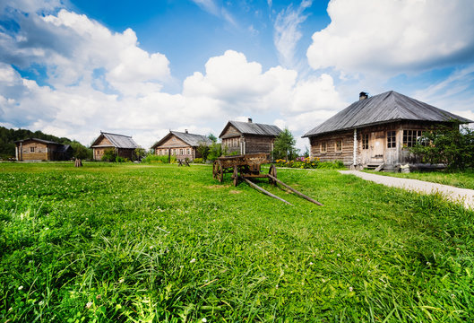 Rustic wooden house on a background of blue sky
