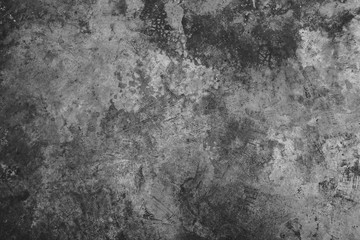 Dark grunge textured cement wall closeup