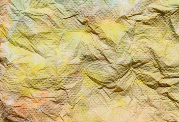 Textural of crumpled tissue paper rendering in multicolored for abstract background.