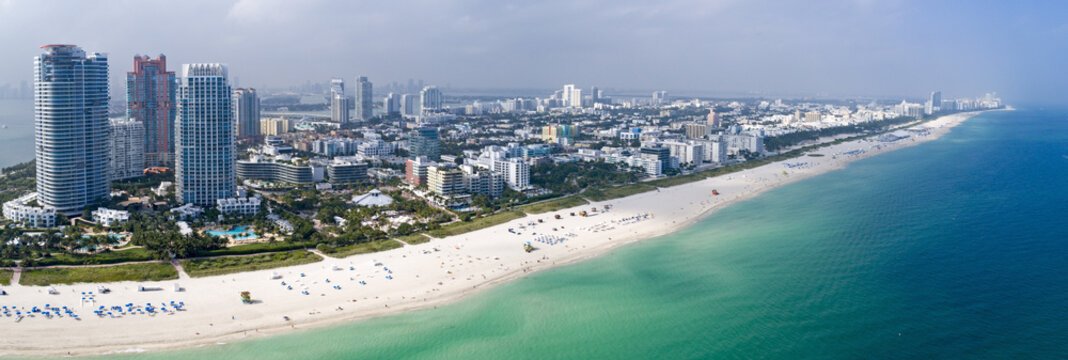 Miami South Beach Aerial Panorama Tourist Destination Sunny Day Hotels and Green Ocean Water