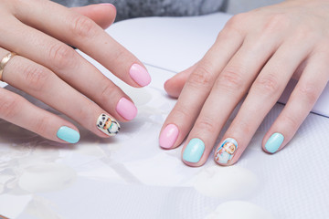 Obraz na płótnie Canvas Perfect manicure and natural nails. Attractive modern nail art design. Gel polish applied.