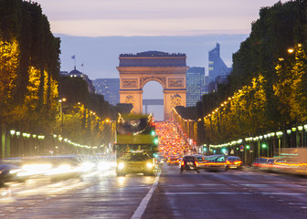 Paris city traffic on Champs Elysees boulevard