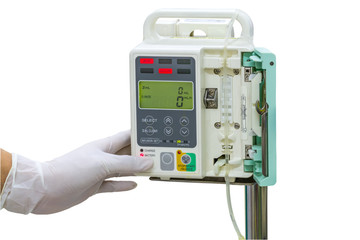 Hand and white medical gloves of doctor control IV on infusion pump on white background.Save with clipping path.