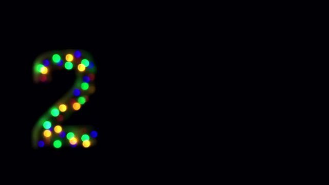 Flashing 2017 message in colorful bokeh bubbles on black background