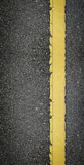 Asphalt with yellow line texture background