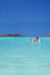 Total relaxation as a man drifts off on the calm waters of tropical Magens Bay, St. Thomas
