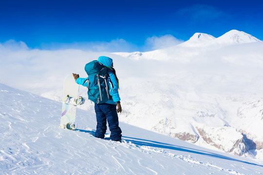Woman, snowboard winter, lift, back, backpack, elbrus