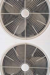 Condenser coil fans of an air conditioner