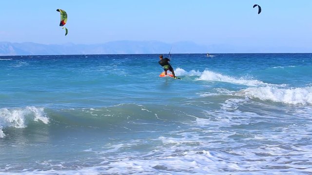 Amazing skills of professional kite surfer. Extreme water sport video background