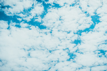 Fluffy white clouds in a blue sky