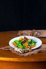 salad with croutons and quail eggs