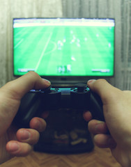 Joystick for video game consoles in the hands © GMisman