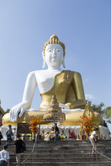 Big beautiful buddha statue sitting on the top of hill inside th