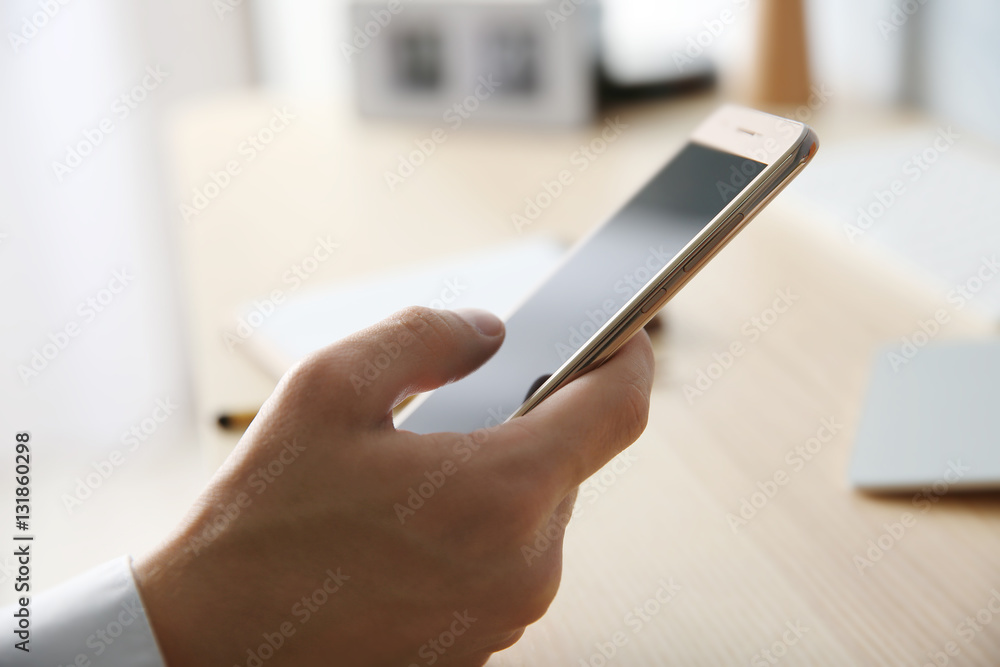 Poster Man using smart phone in office