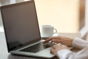 Businessman using laptop, closeup