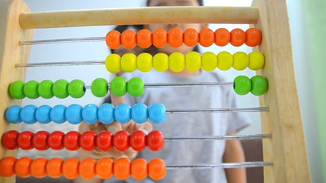 HD Close up shot asian little girl playing abacus