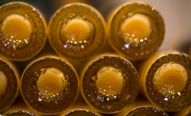 many bottles on the counter in the store