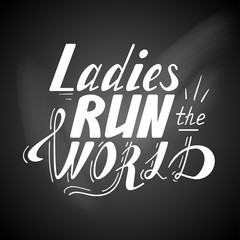 Hand written lettering Ladies run the world made in vector. Hand drawn card, poster, postcard, t-shirt design. Ink illustration. Modern calligraphy on a chalkboard.