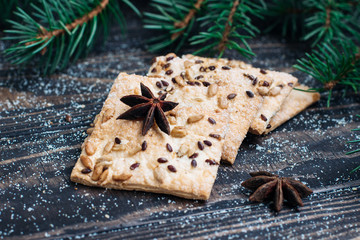 homemade cookies with sesame seeds and sunflower seeds on a wooden background Christmas theme