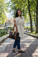 Fototapeta premium Beautiful Young Woman Outdoors. Enjoy Nature. Healthy Smiling Girl