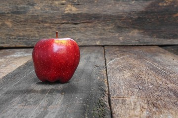 Red Apple Close up on wooden table  background