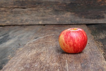 Red Apple Close up on wooden table  background