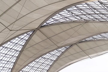 Modern architecture with glass façade and textile sunroofs 