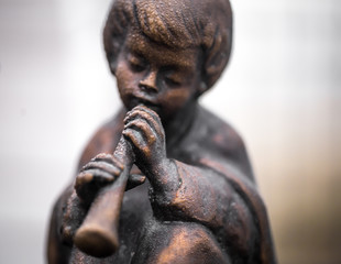 Statues of children playing musical instruments