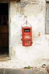 Indian post mail box hanging on rustic wall