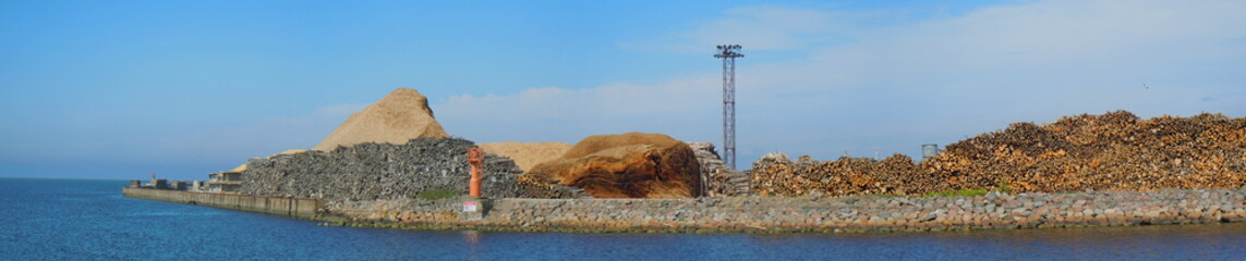  Panoramic view of harbour with stacked logs