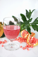 Glass of Pomegranate Juice on White Background